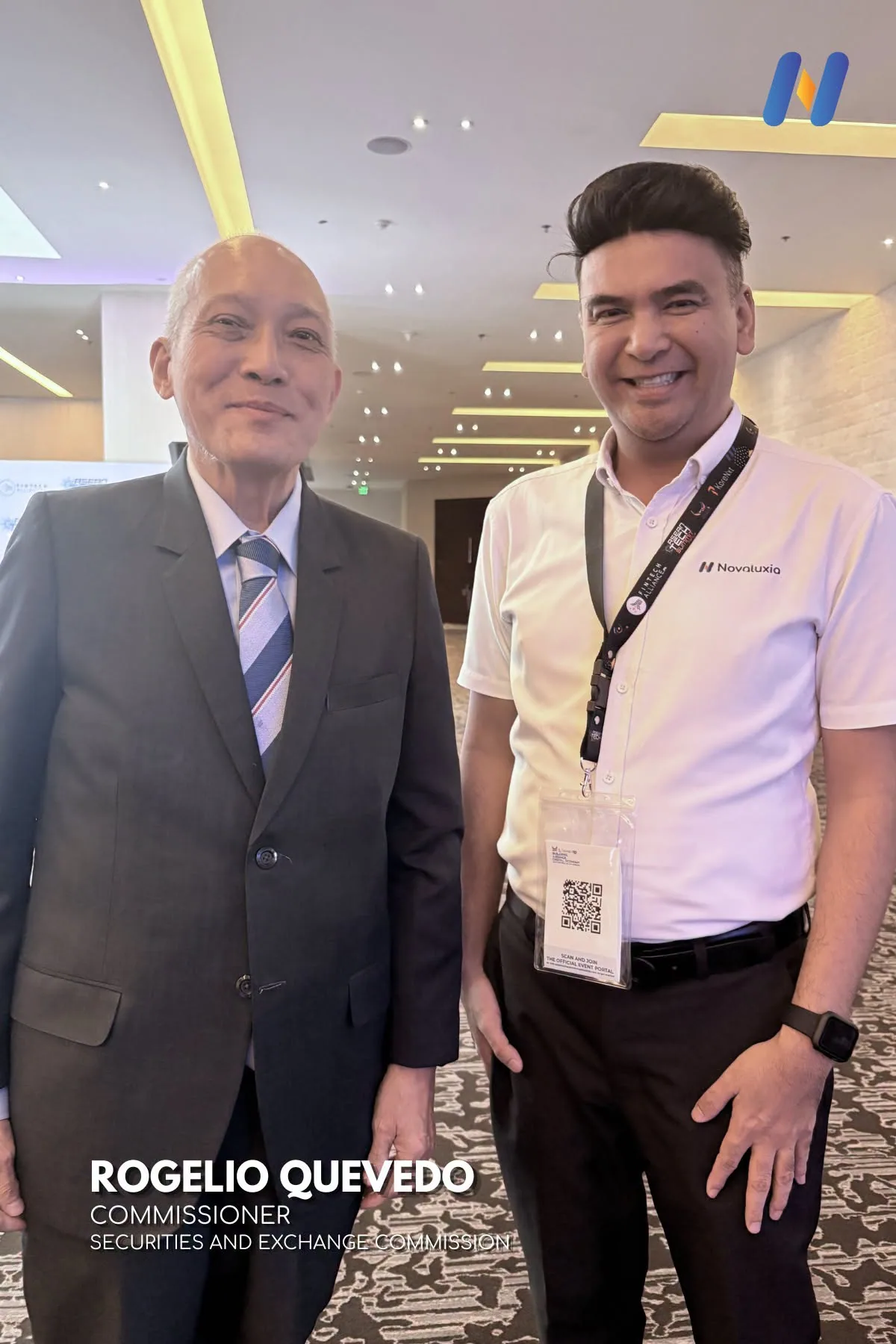 Novaluxia team member photographed with Rogelio Quevedo, Commissioner, Securities and Exchange Commission, in the event corridor